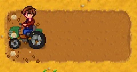 A farmer on a tractor in Stardew Valley.